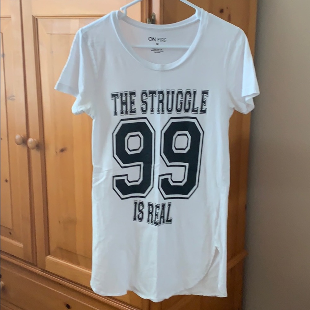 Short sleeved “THE STRUGGLE IS REAL” top.